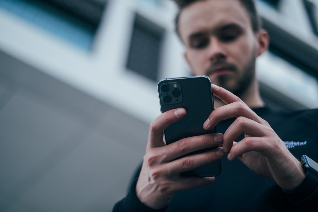 Person using a smartphone, representing privacy in AI companion conversations