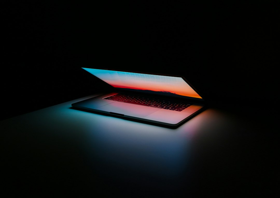 Laptop workspace representing a creator AI revenue dashboard