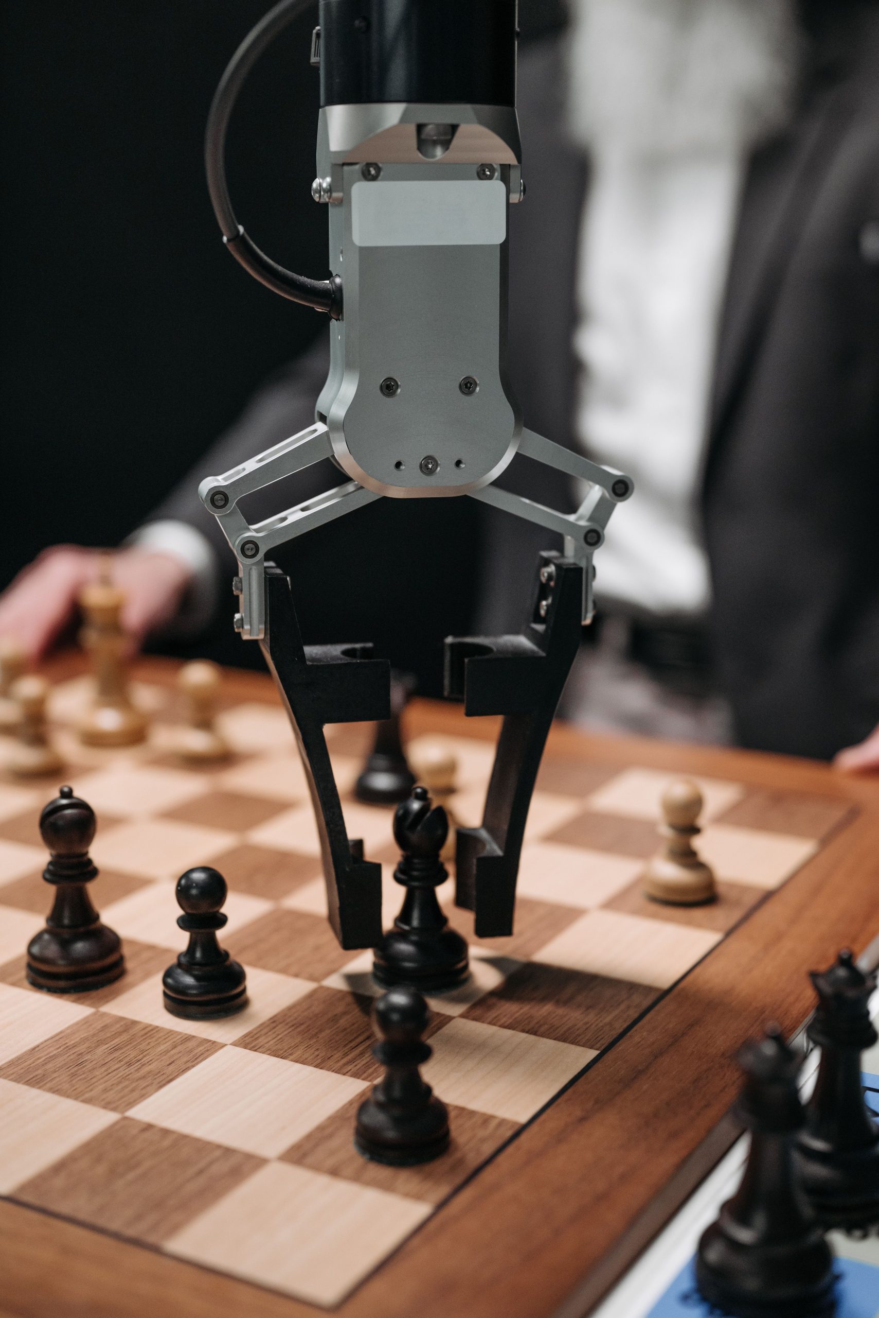 Human and robotic arm interaction representing AI companion versus AI social