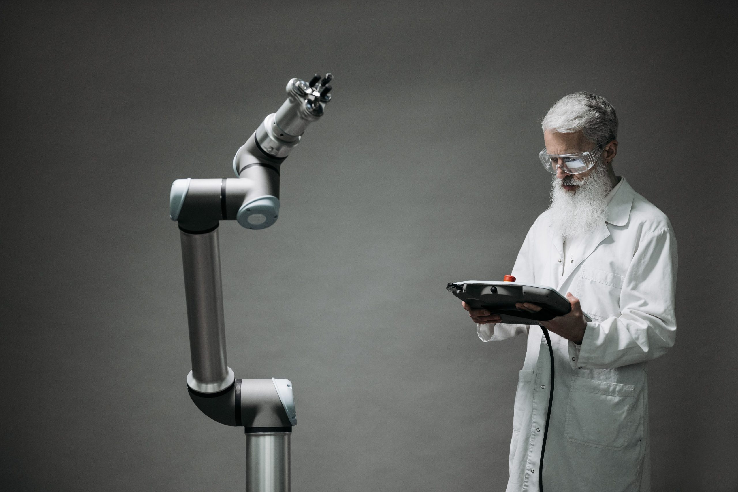 Scientist working with a robotic system representing digital humans and AI