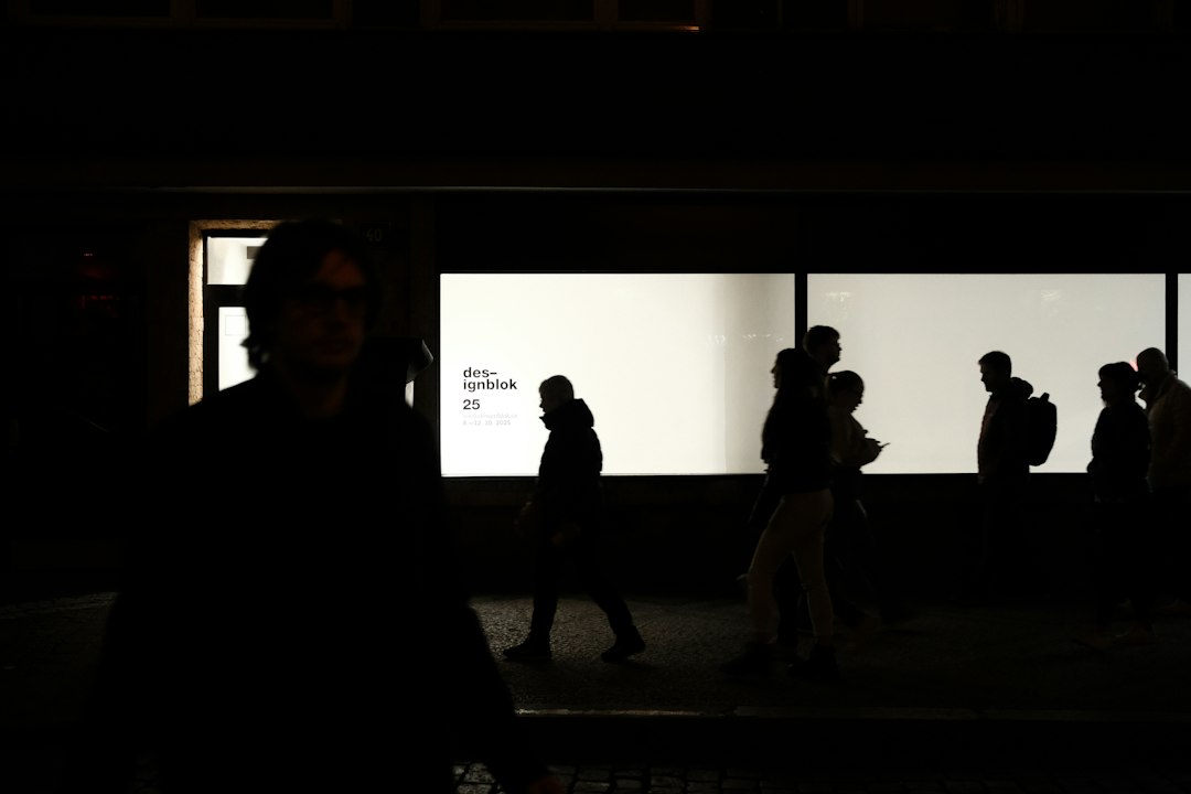 People passing a bright city window illustrating digital twin knowledge conflict resolution